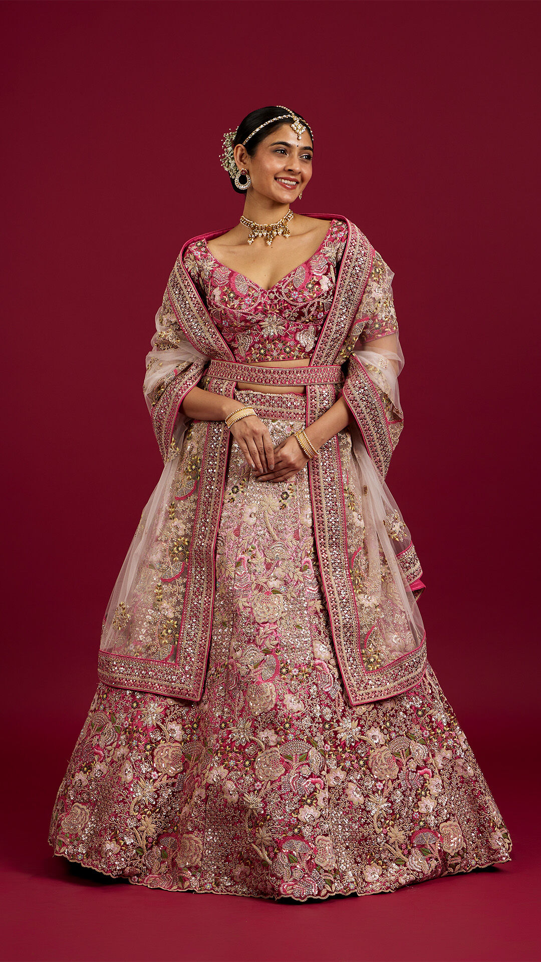 A bride in beautidull pink bridal lehenga